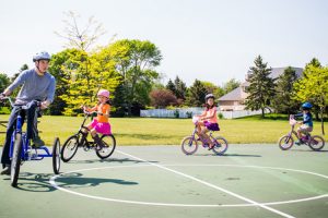 Louis McManus and his siblings ride their bikes.